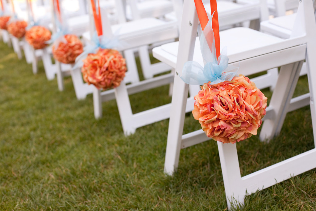 Beautiful orange Wedding Flower Arrangements Along the Aisle
